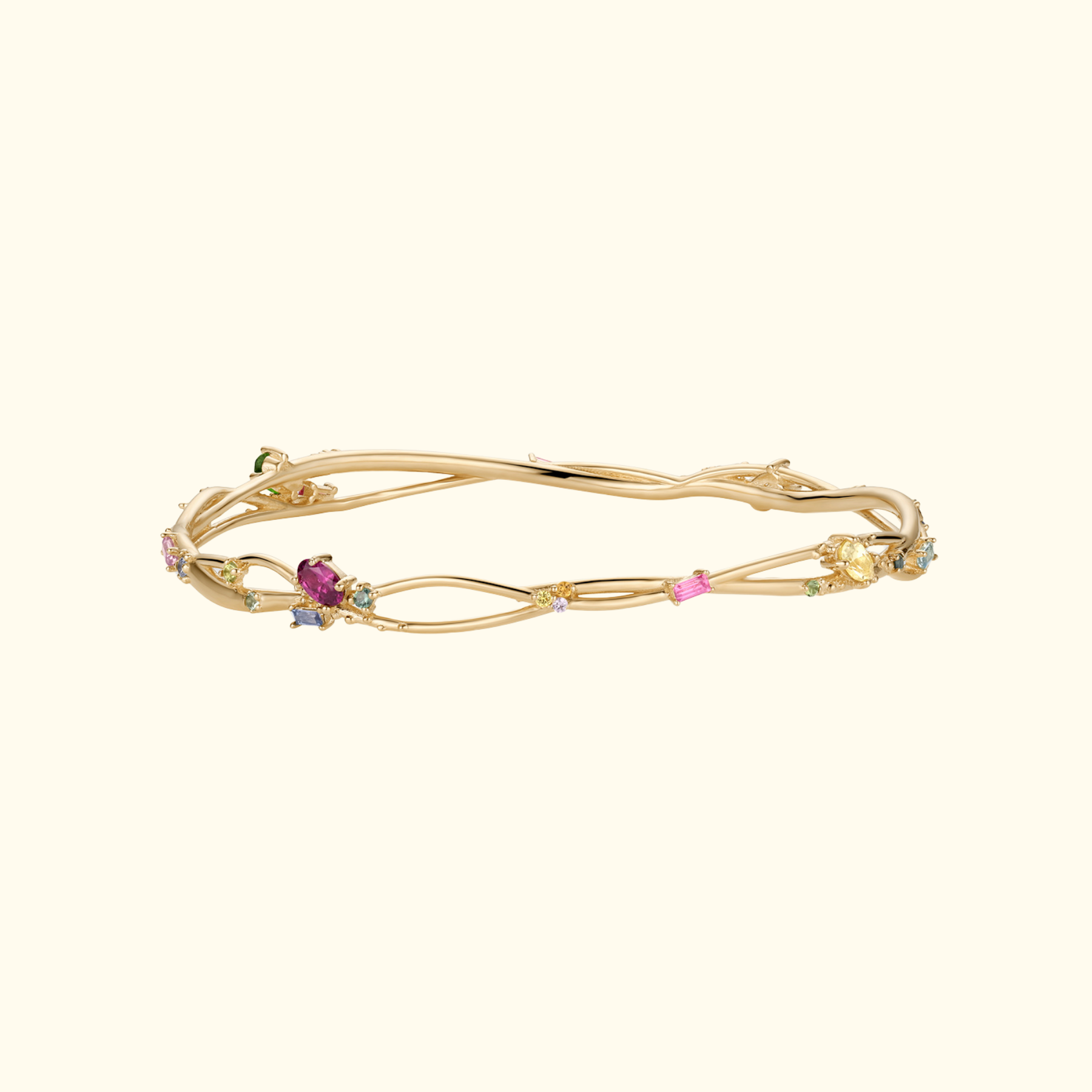 organic interweaving bangle in 14k gold with colored gemstones by jessica liu