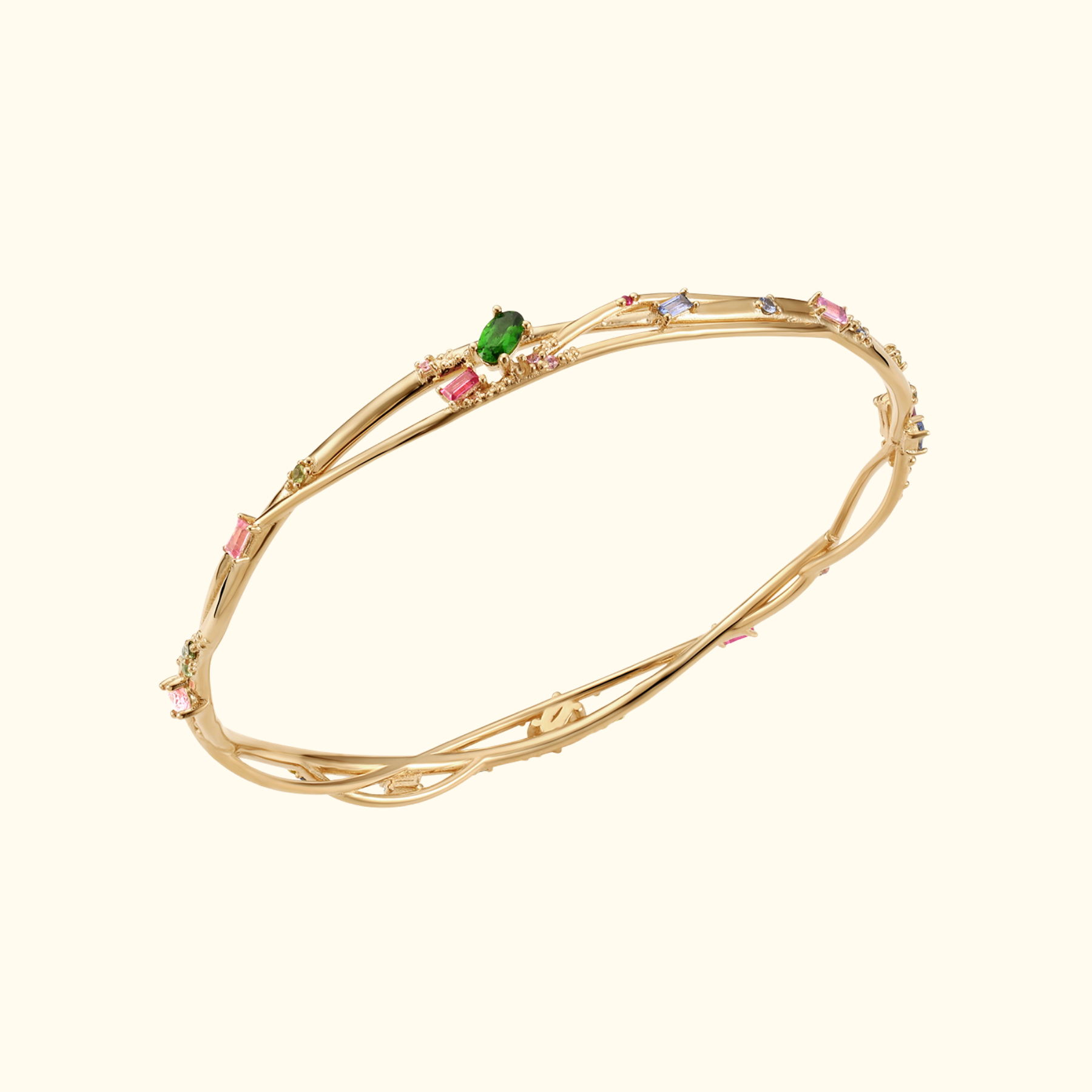 organic interweaving bangle in 14k gold with colored gemstones by jessica liu