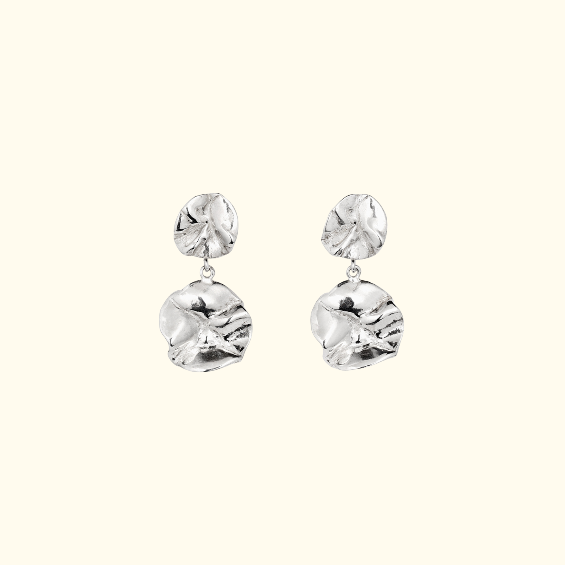 sculptural double lilypad dangling earrings in silver by jessica liu