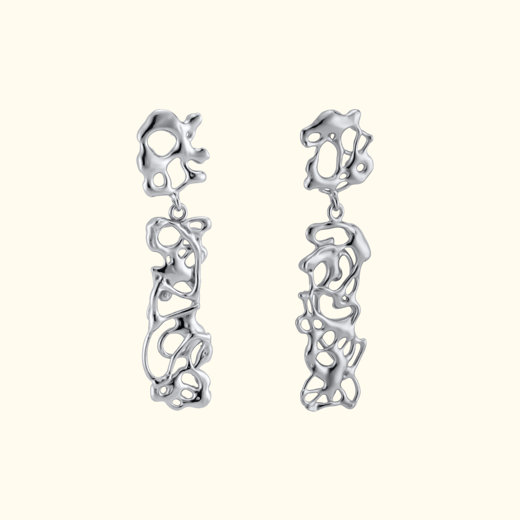 abstract squiggly dangling earrings in silver by jessica liu