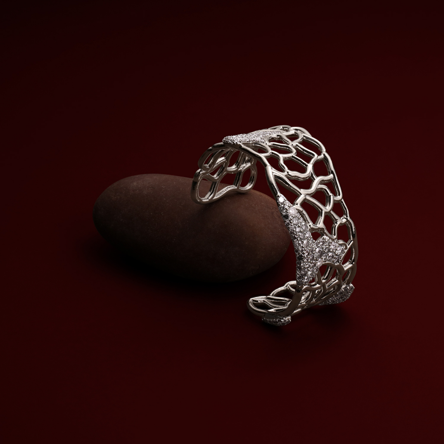 organic abstract cuff bracelet in white gold with salt and pepper diamonds by jessica liu