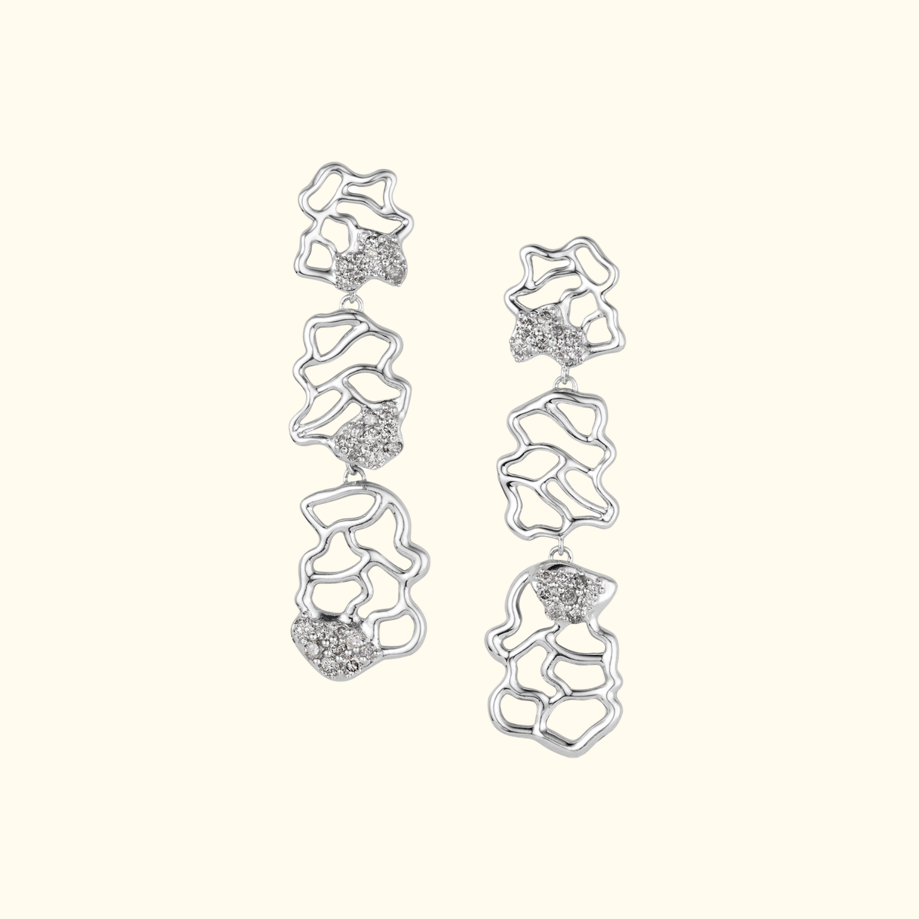 organic abstract three drop earrings in white gold with salt and pepper diamonds by jessica liu