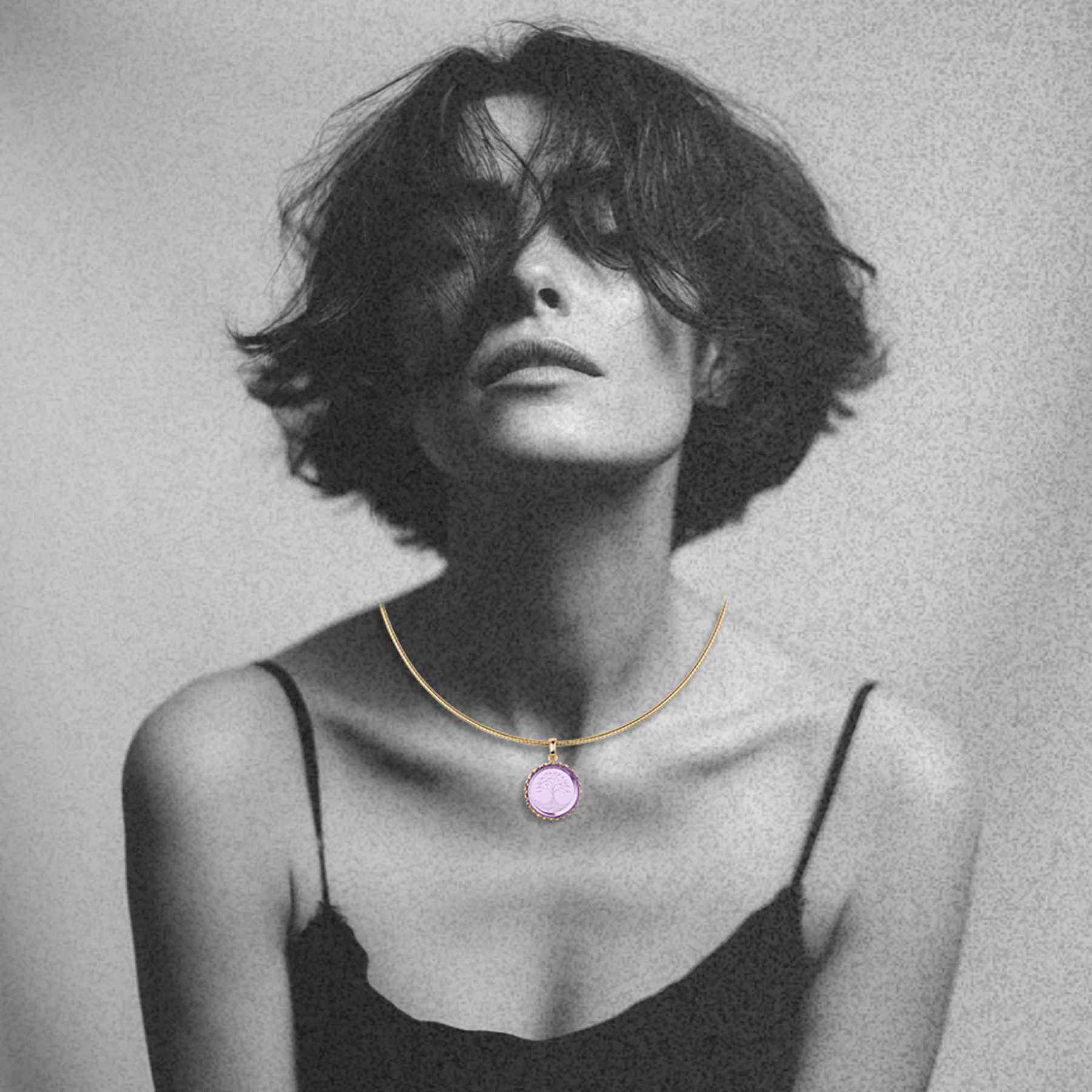 woman wearing a gold omega chain with a tree of life intaglio on round amethyst stone in 14k gold pendant setting by jessica liu