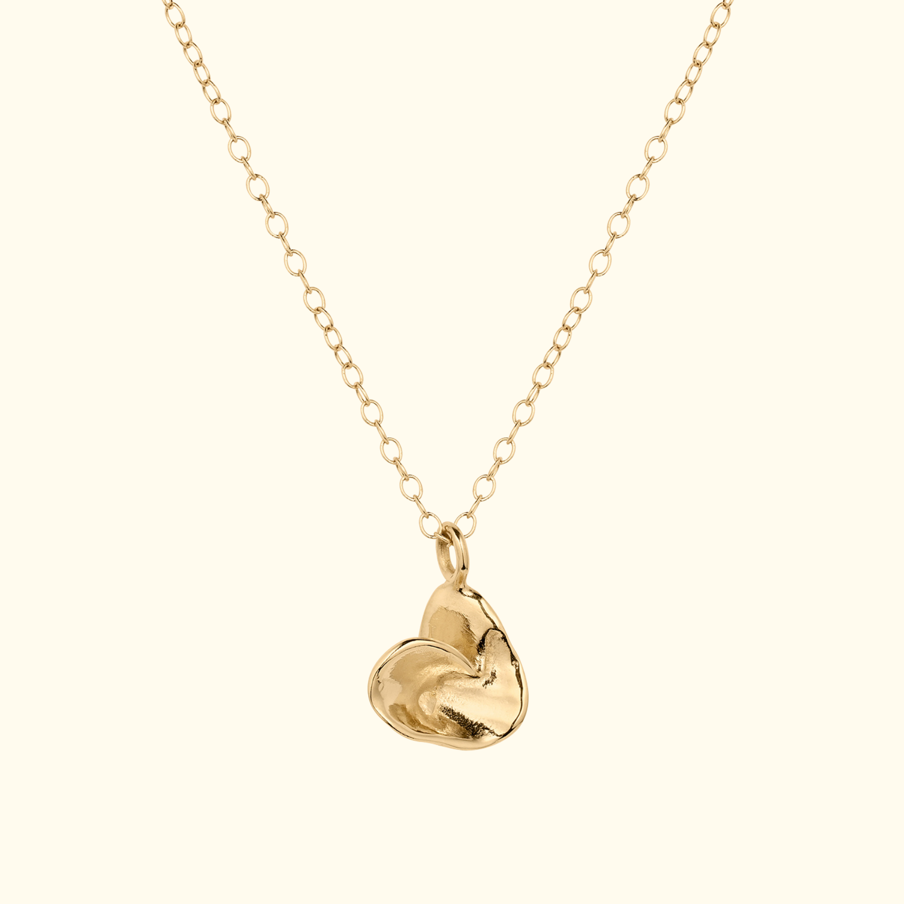 folded origami heart necklace in 14k gold by jessica liu
