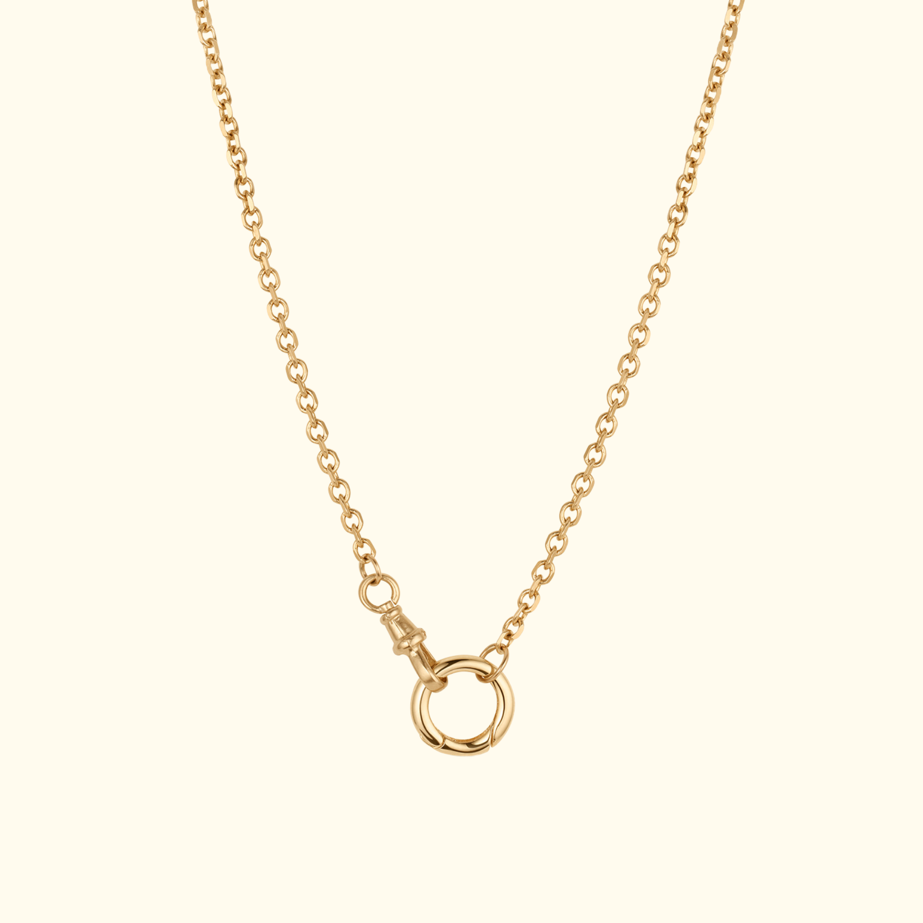 closeup of 14k gold cable chain with swivel clasp and enhancer bail by jessica liu