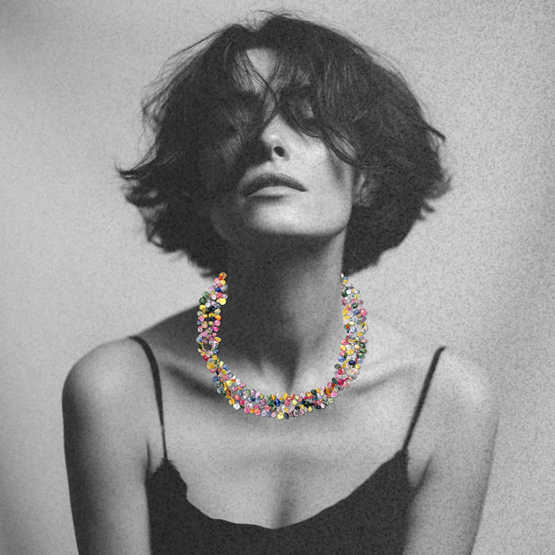 double strand of multicolored sapphire gemstones on a woman's neck by jessica liu 