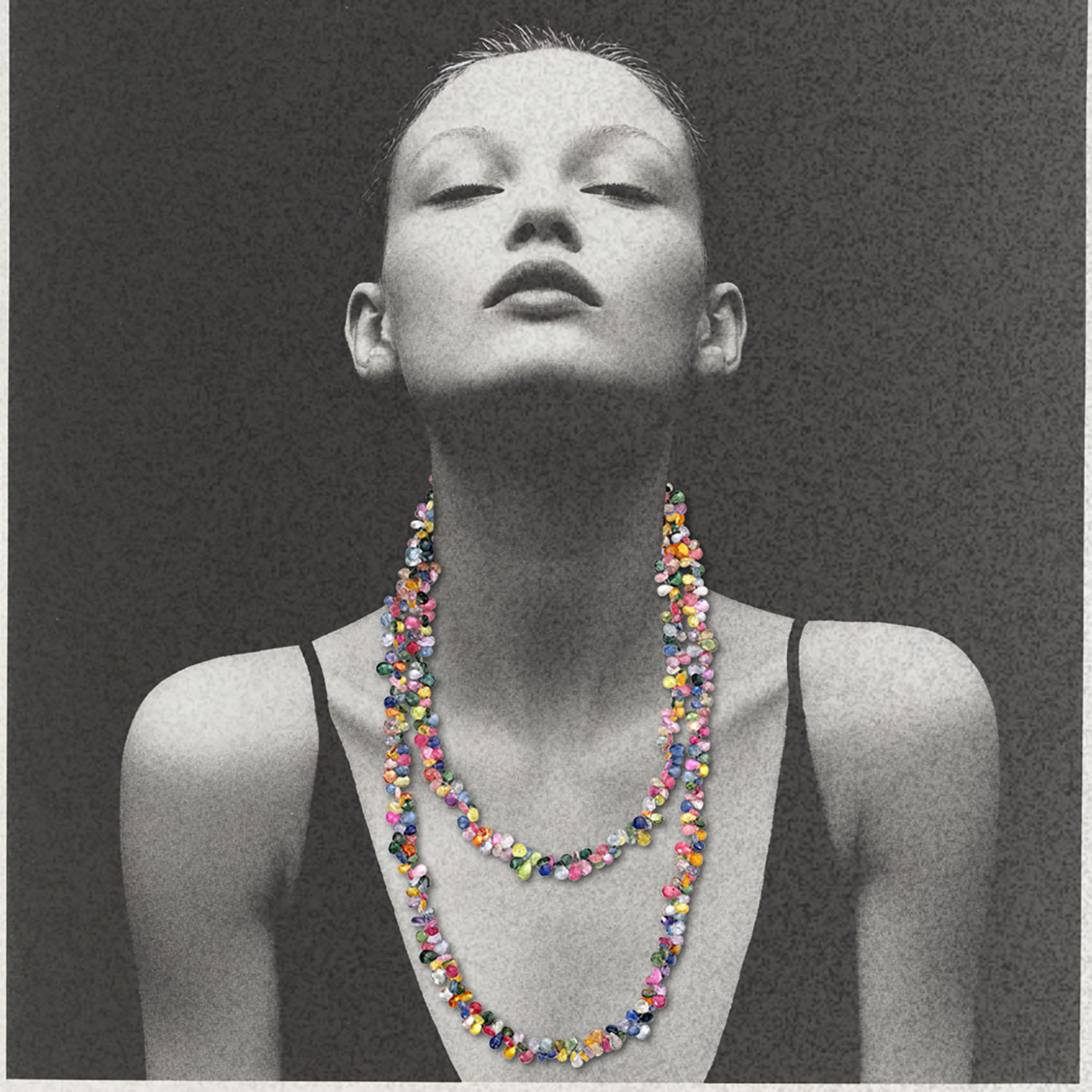 woman wearing extra long multicolored sapphire gemstone necklace with a 14k gold ball clasp by jessica liu