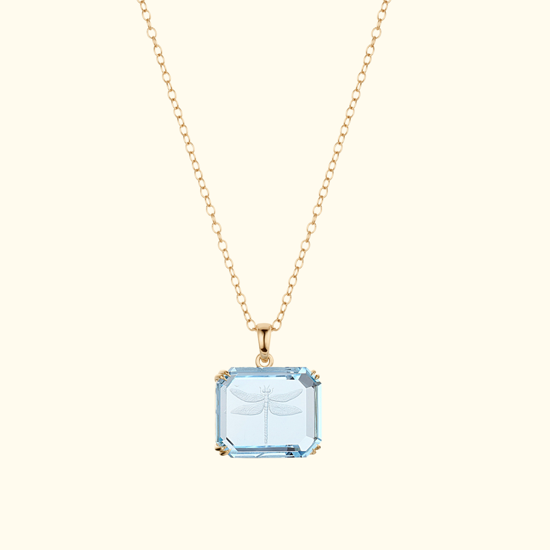 dragonfly intaglio carving on a rectangular blue topaz pendant in 14k gold by jessica liu 