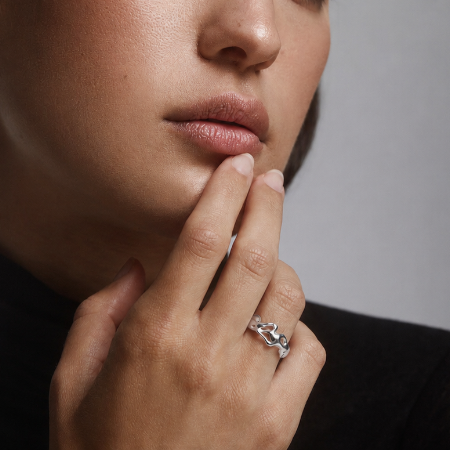 woman wearing organic squiggly ring band in silver by jessica liu