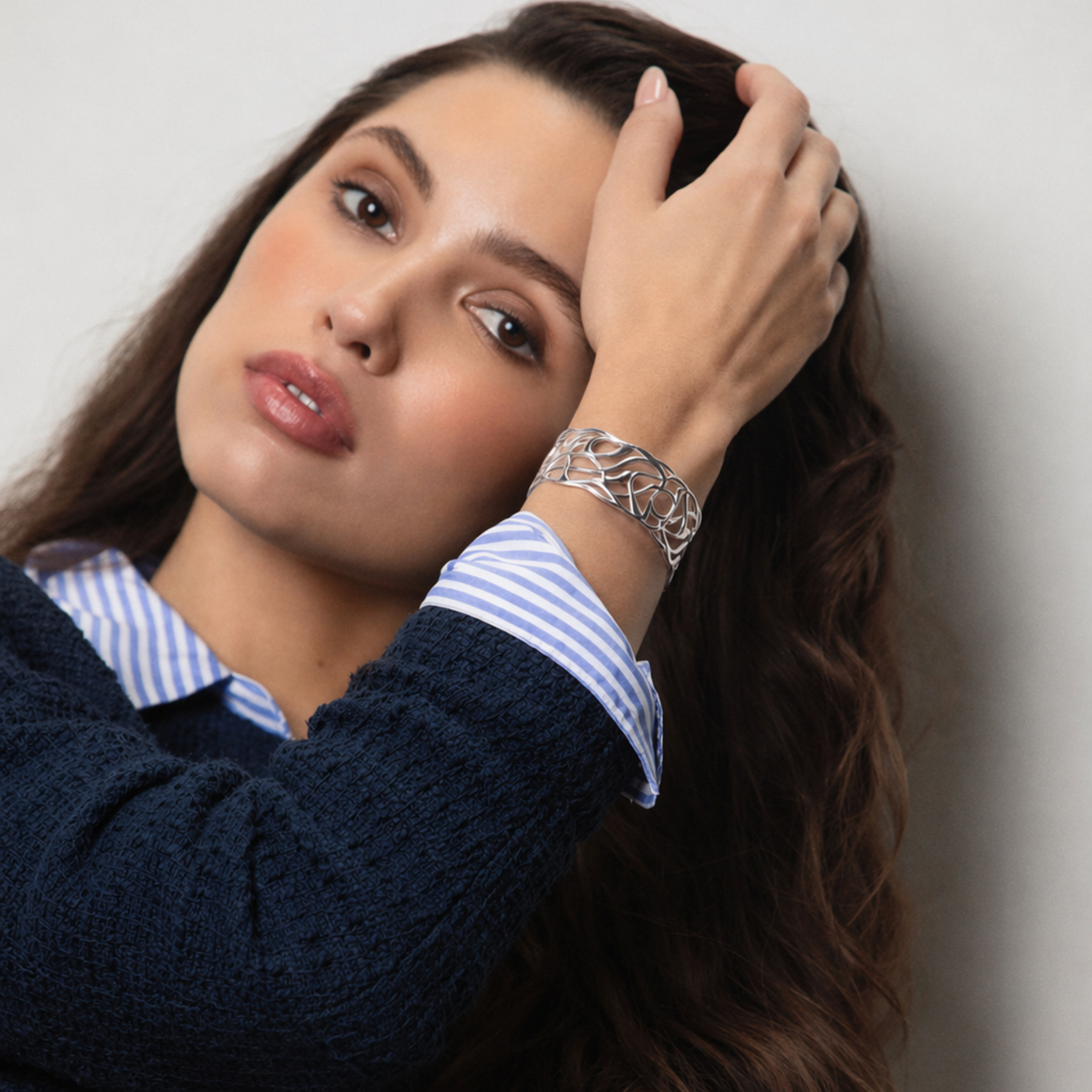 model wearing artful fluid lines cuff bracelet in silver by jessica liu