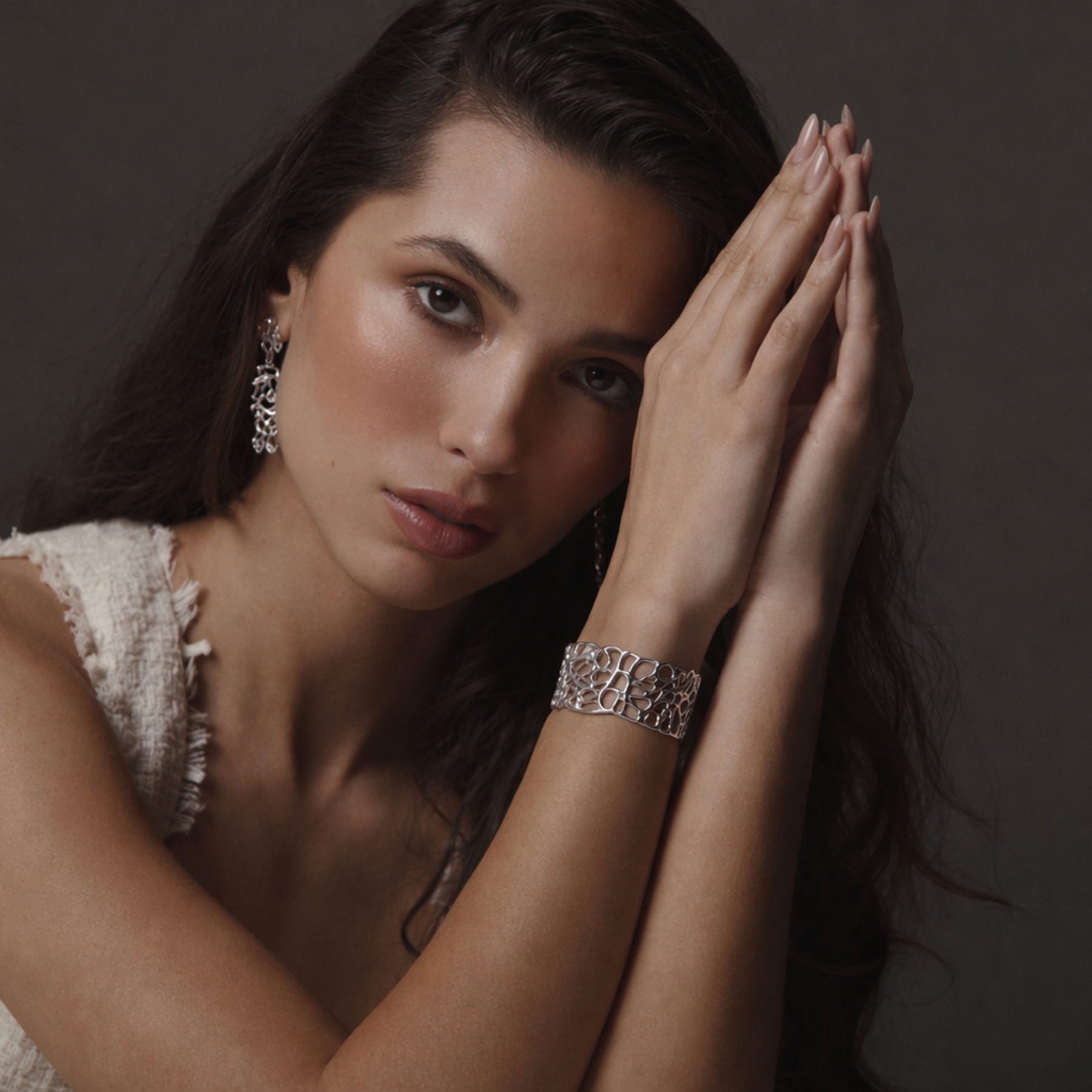 model wearing organic and fluid coral cuff bracelet in silver by jessica liu