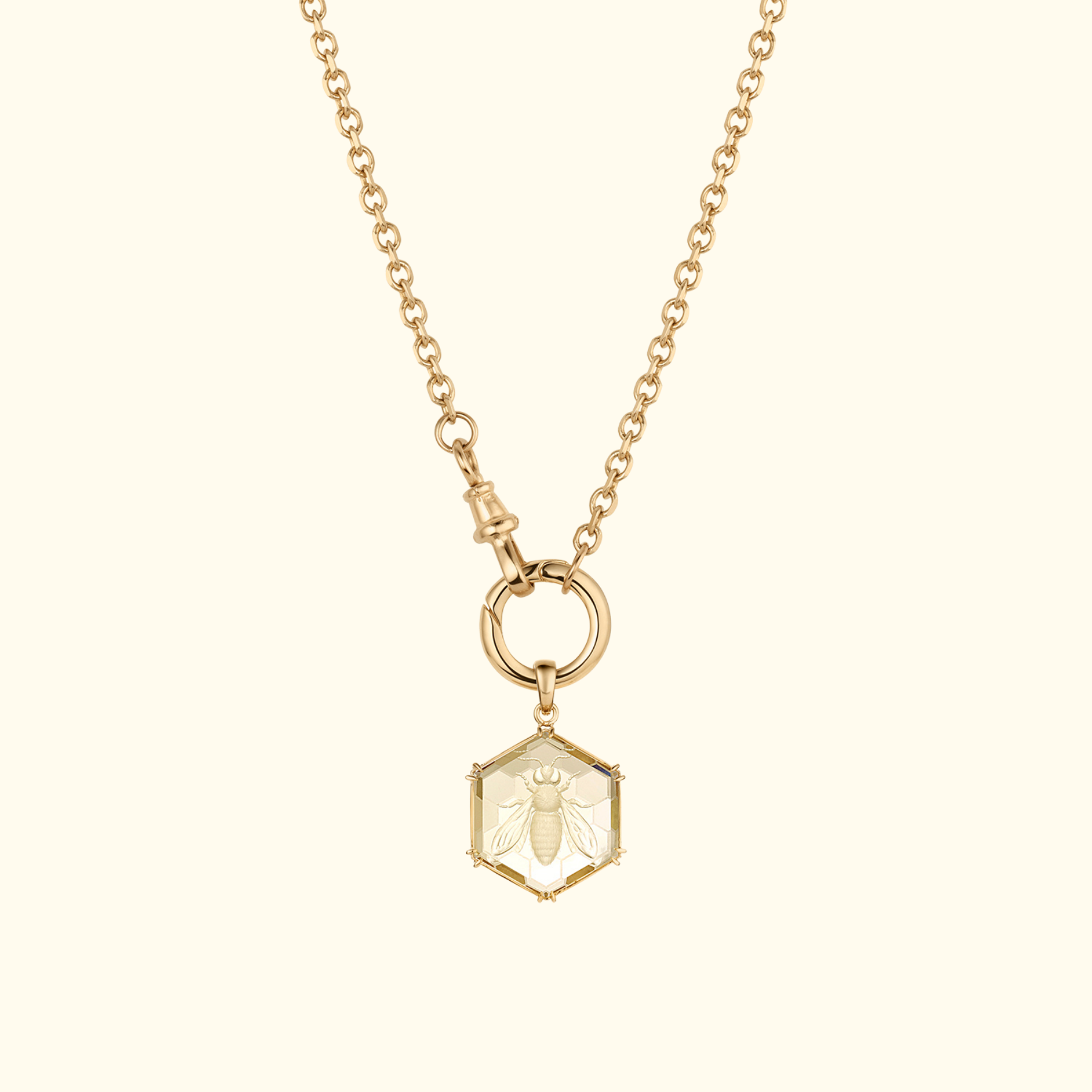 honeybee intaglio carving on a hexagon citrine pendant on a long chain with charm holder in 14k gold by jessica liu 