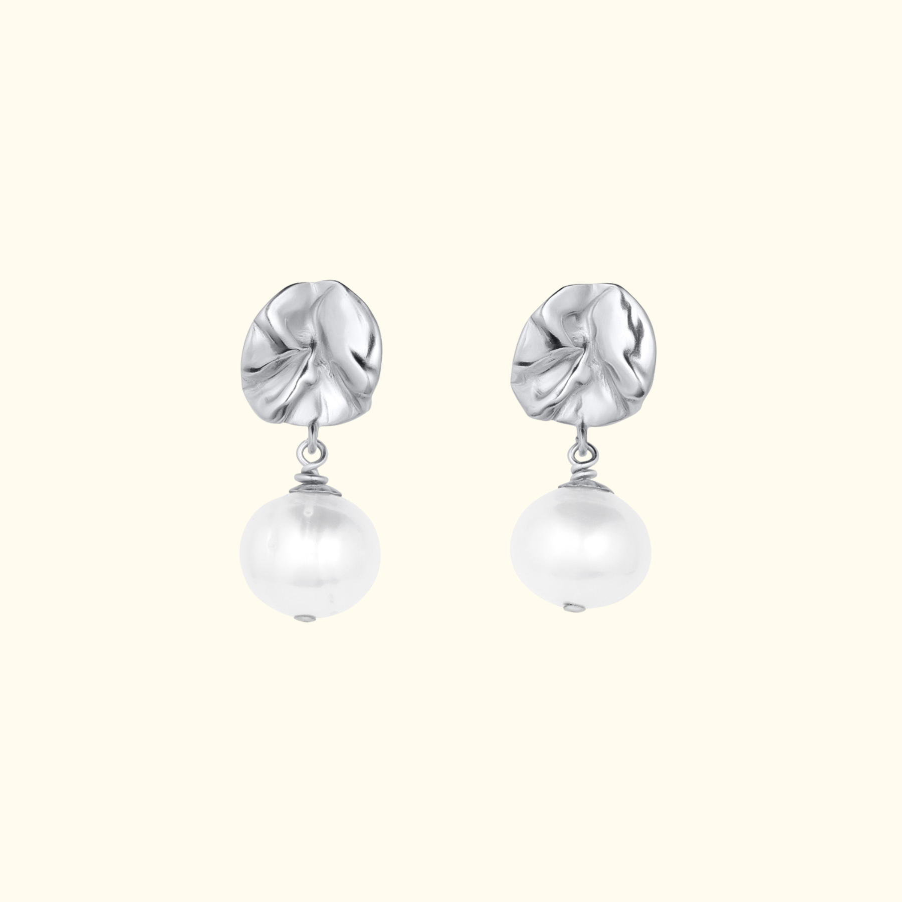 organic lily pad earrings in silver with a pearl drop by Jessica Liu