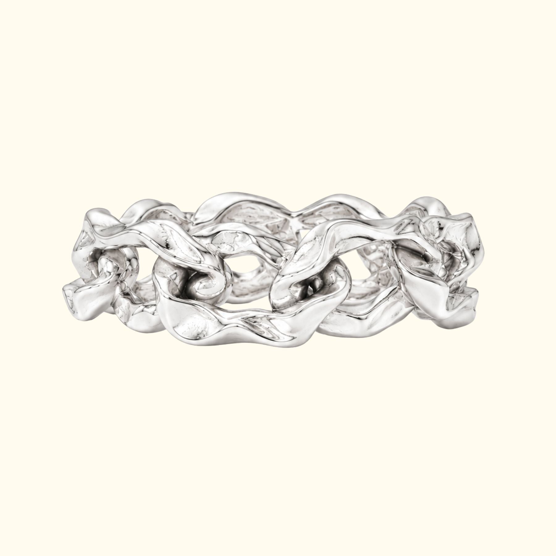 A chunky silver chain-link ring by Jessica Liu with a highly textured, organic, wavy interlocking design, shown on a solid cream background.